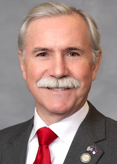 Headshot of  Dennis Riddell