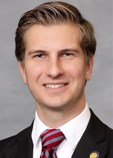 Headshot of  Jake Johnson